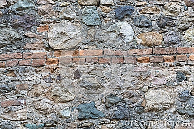 Very ancient wall with stones and bricks Stock Photo