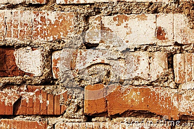 Old red brick wall with cracks and scuffs, style loft background Stock Photo