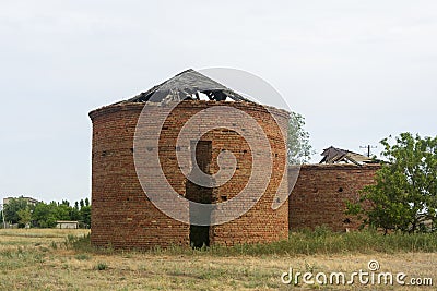 Old red brick water towers. Ruined building of the last century Stock Photo