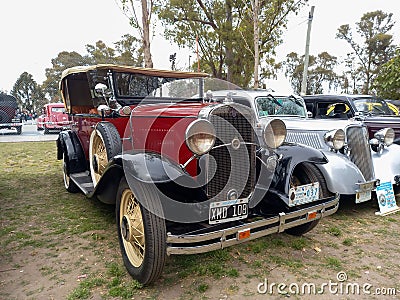 Old red 1931 Chevrolet Chevy Phaeton four door by GM in a park. AAA 2022 classic car show Editorial Stock Photo