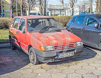 Old red compact car Fiat Uno four doors parked Editorial Stock Photo