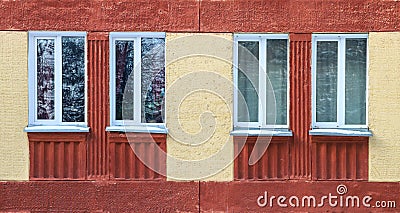 The old red house. Four windows Stock Photo