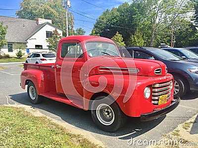 Old red vintage pick-up truck Ford Editorial Stock Photo