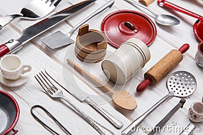 Old red white doll's kitchen miniatures of tin and wood. Vintage Stock Photo