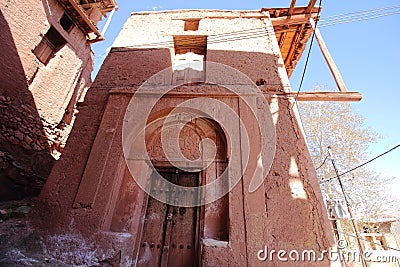 An old house made from reddish stone in Abyaneh Village, Iran. Editorial Stock Photo