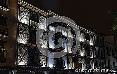 Old restored brick facade with lighting in the central square ca Stock Photo
