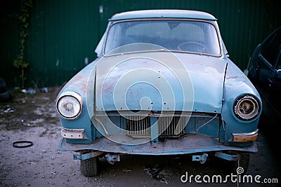 old retro car in a car dump Stock Photo