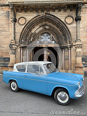 Old retro car in front of the University of Glasgow Editorial Stock Photo