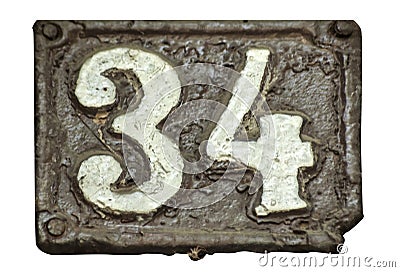 Old retro cast iron plate number 34 Stock Photo