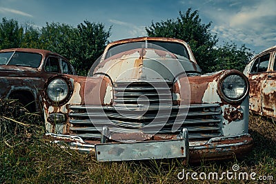 Old retro rusty abandoned and forgotten cars, cemetery of vintage autos Stock Photo