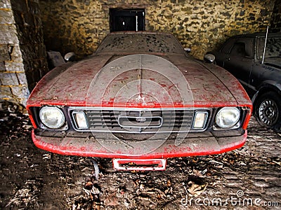 Old retro rusty car in village garage Stock Photo