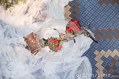 Old retro tandem bicycle and christmas decors, red flowers. Travel photo 2018. december Editorial Stock Photo