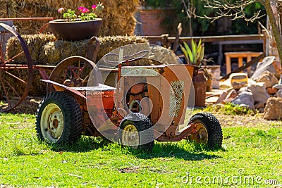 an old retro tractor as a agriculture vehicle Stock Photo