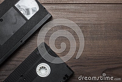 Old retro video tape on wooden background Stock Photo