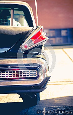 Old retro vintage classic black chromed car park at petrol station in Woking UK. Stock Photo