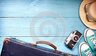 Old retro vintage suitcase and camera tourism travel background Stock Photo