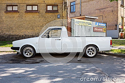 Old retro white volkswagen pickup on the street Editorial Stock Photo