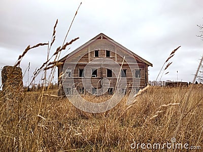 An old rickety dilapidated residential log wooden house Stock Photo