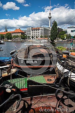 Berlin, Spree river, Germany. Old river ships at the embankment Editorial Stock Photo