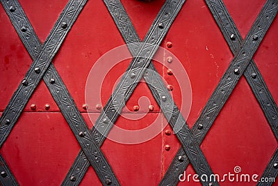 Old riveted metal red painted door Stock Photo
