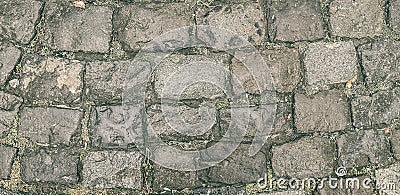 The old road of broken paving stones. It can be used for backgrounds, textures Stock Photo