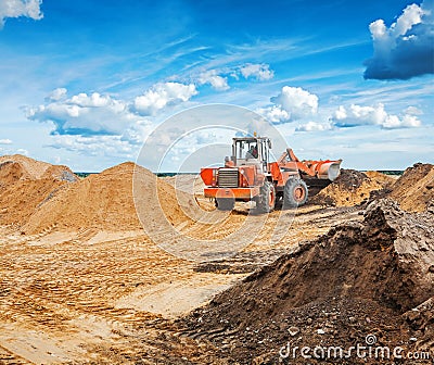 Old roadworking tractor working with construction Stock Photo