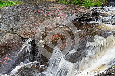 Old rock carving from the stone age by a creek in Sweden Stock Photo