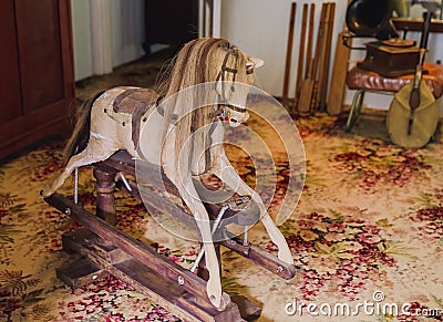 Old Rocking Horse In Bedroom Of Historic Home Stock Photo