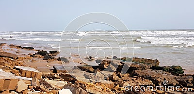 old rocks in front of sea waves and sky Stock Photo