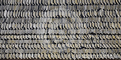 The old roof of an ancient barn, created from wooden shards, darkened by weather influence Stock Photo