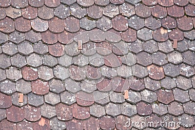 Old roof with odd rooftiles Stock Photo