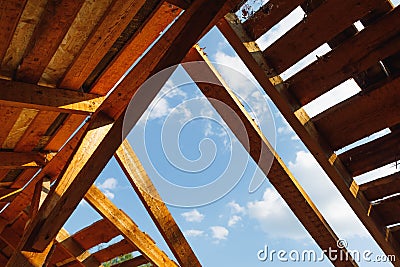 Old roof renovation, frame of the roof against blue sky background Stock Photo