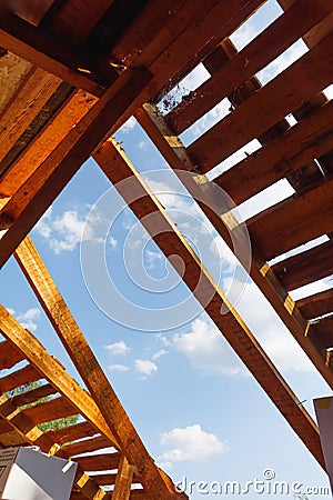 Old roof renovation, frame of the roof against blue sky background Stock Photo