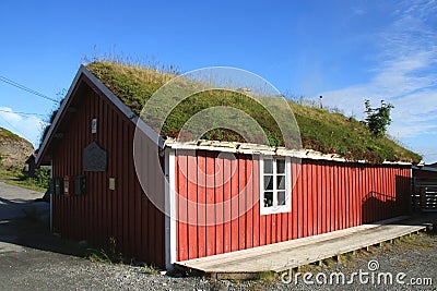 Old rorbu with grass on the roof in Sund Stock Photo