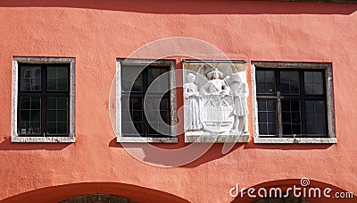 Old rose color facade and sculpture Stock Photo