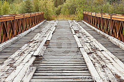 Old rotten abandoned bridge leading to nowhere Stock Photo