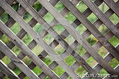 Old rough rhomb shaped fence. Stock Photo