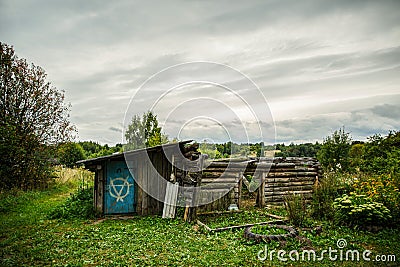 An old, ruined barn in the village. Stock Photo