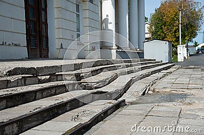 Old ruined stairs in the city center Stock Photo