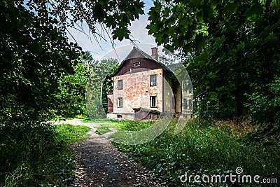 Old run down house with crumbling facade, still inhabited by residents Stock Photo