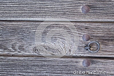 Old run-down wooden door and doorknocker Stock Photo