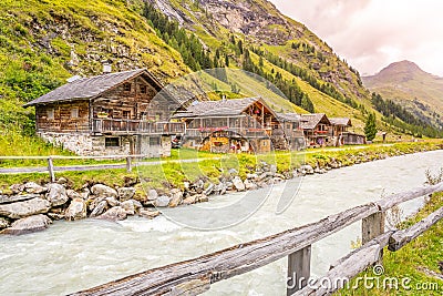 Old rural wooden houses in alpine valley Stock Photo