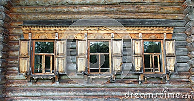 Old russian wooden house with decorated windows Stock Photo