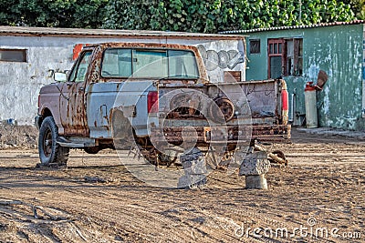 Old rusted abandoned car no tires Stock Photo