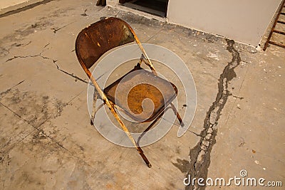 An old rusted abandoned iron chair showing loneliness and solace Stock Photo