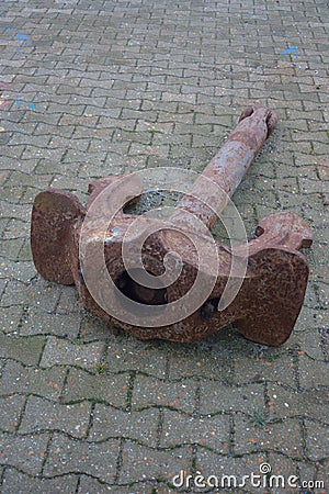 Old rusted anchor of a boat Stock Photo