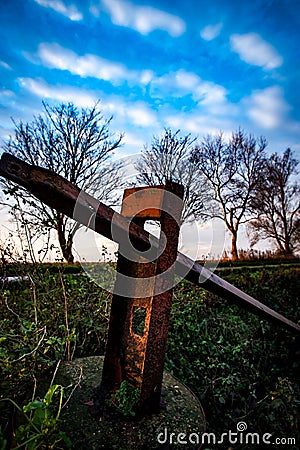 Old rusted fence post Stock Photo