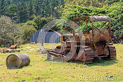 An old, rusted-out bulldozer on a farm Stock Photo