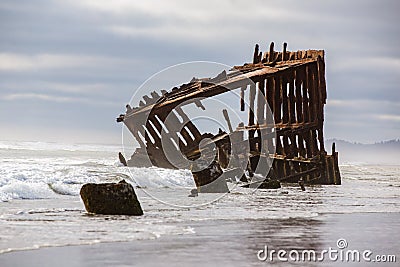 Old rusted shipwreck at the Oregon coast. Stock Photo