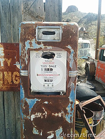 Old, rusted vintage gas pump in the desert Editorial Stock Photo